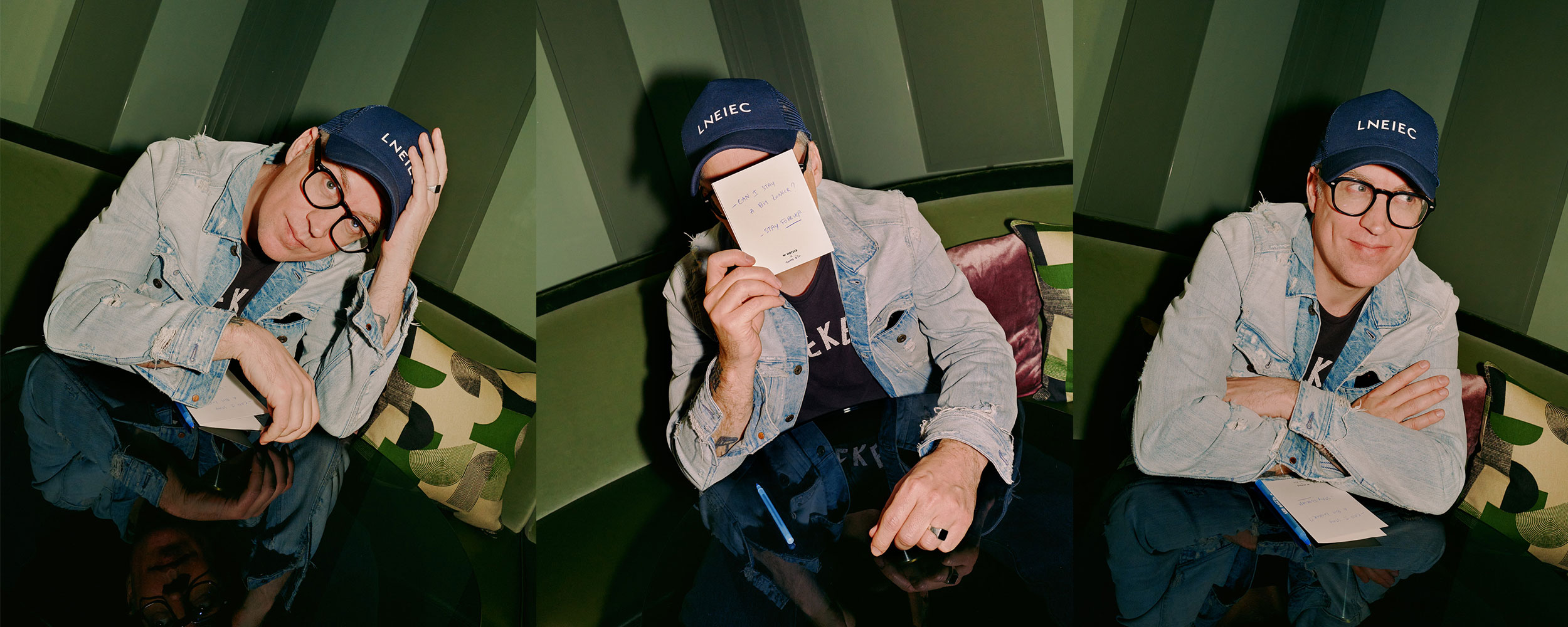 A person is sitting on a green sofa wearing a denim jacket, glasses, and a dark cap. In the first image, they are resting their head on their hand. In the second, they are holding a notebook with the text 