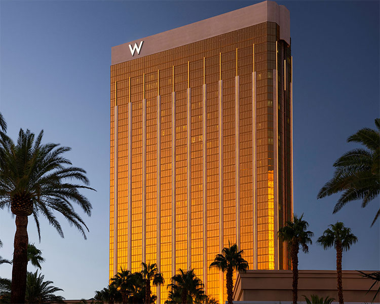 A tall gold-colored hotel building with a prominent 